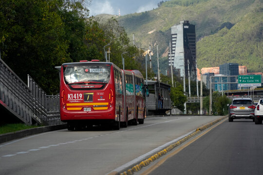 BOGOTA, COLOMBIA - NOVEMBER 1 2025: TransMilenio BRT Bus B12 on Dedicated Lane in Bogota Colombia