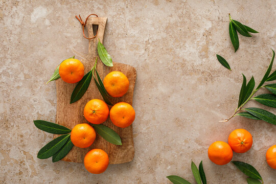 Mandarins fresh citrus fruit with green leaves