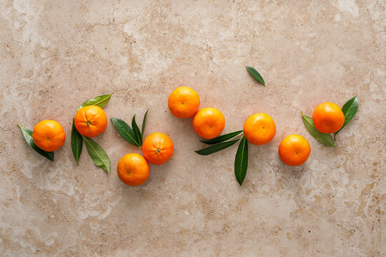 Mandarins fresh citrus fruit with green leaves