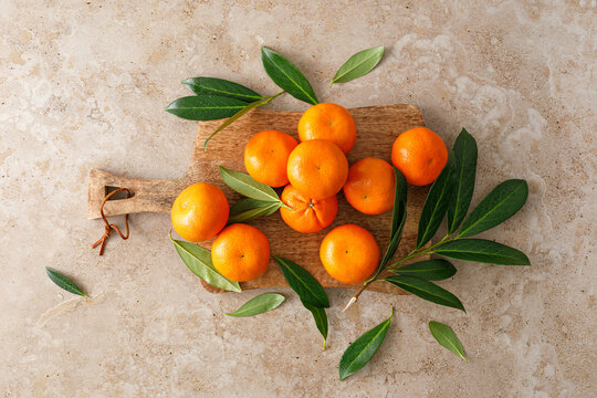 Mandarins fresh citrus fruit with green leaves