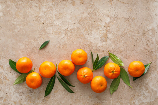 Mandarins fresh citrus fruit with green leaves