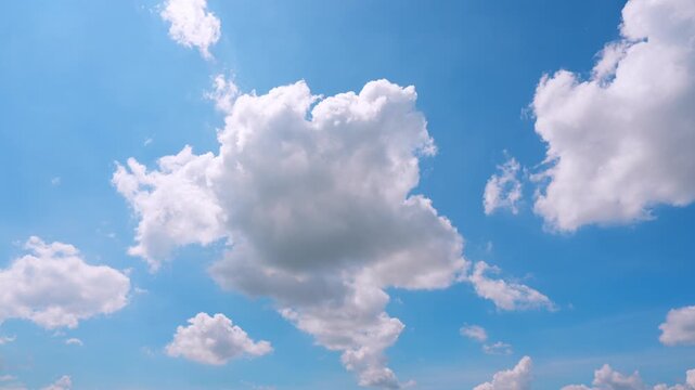 A cumulus congestus clouds rise into a brilliant blue sky in this dramatic timelapse, showcasing vigorous vertical development, sunlit white peaks, and shadowy bases shaped by atmospheric convection.
