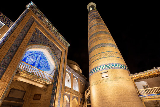 Khiva, Uzbekistan. The minaret of the Islam Khodja madrasah, the tallest in the country, illuminated at night