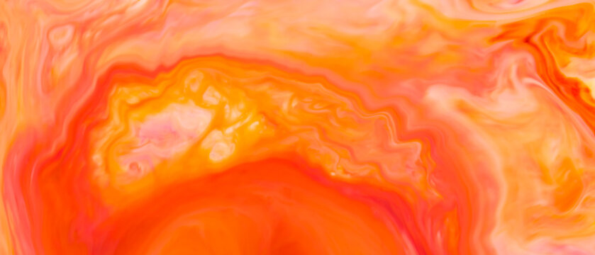 Red and orange fluid art with liquid paint creating layered bands across an abstract background