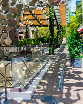 Stylish Tropical Outdoor Dining Terrace with Lush Greenery