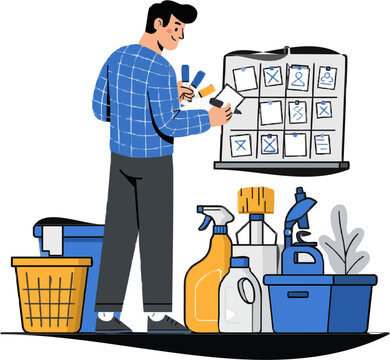 A man in a blue plaid shirt is meticulously arranging cleaning supplies on a board with pictograms for organizing household chores after the holiday break