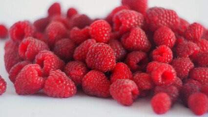 Fresh ripe raspberries piling up, offering a sweet, juicy, and healthy organic fruit snack © Volodymyr_sh