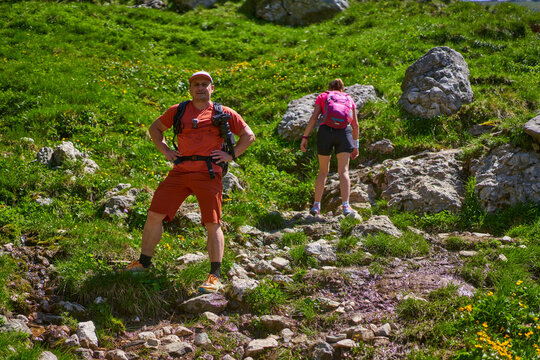 Hikers on rocky trail in Bucegi