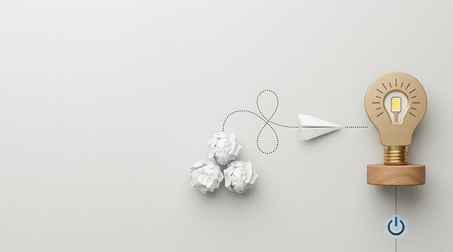 Creative business innovation concept featuring crumpled paper balls and a paper airplane flying toward a golden light bulb trophy, representing the journey from failed ideas to successful solutions.
