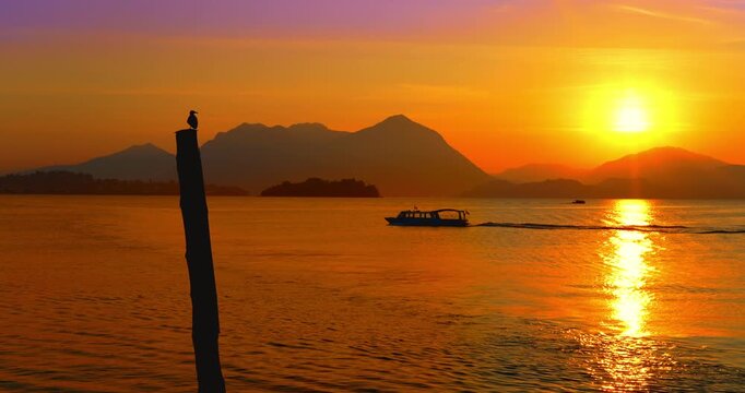 Boat at dawn on lake Maggiore