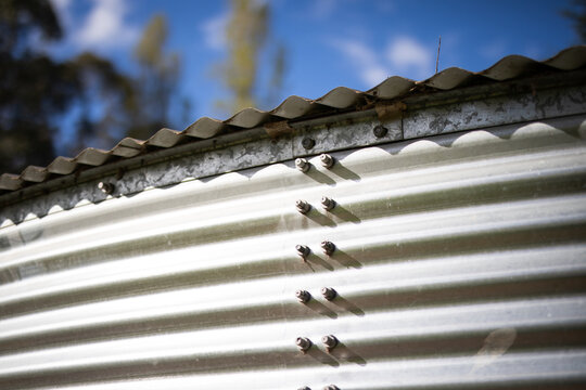 Rustic Metal Silo Structure Under Blue Sky