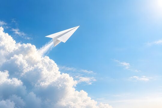 White paper airplane flying through fluffy clouds in bright sky