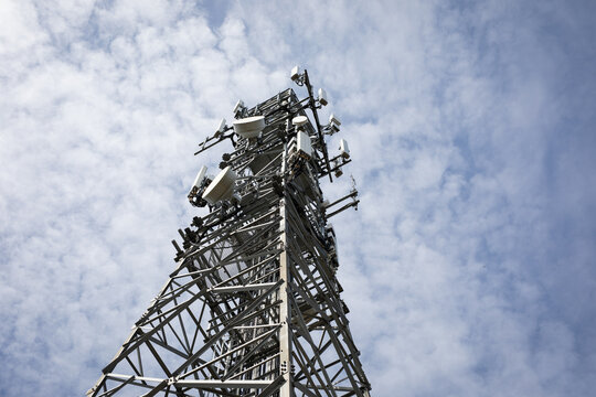 Communication Tower Against Cloudy Blue Sky