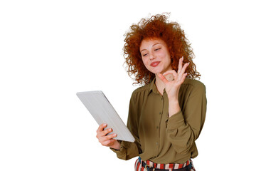Redhead woman holding tablet and gesturing okay sign, expressing approval and success on transparent background © Komora