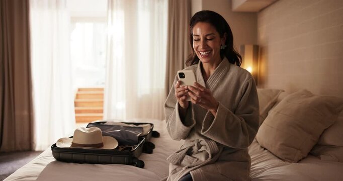 Phone, laugh and woman in bedroom at hotel for guest review, online message and social media. Happy, travel and mature person on cellphone for accommodation, hospitality and internet meme on holiday