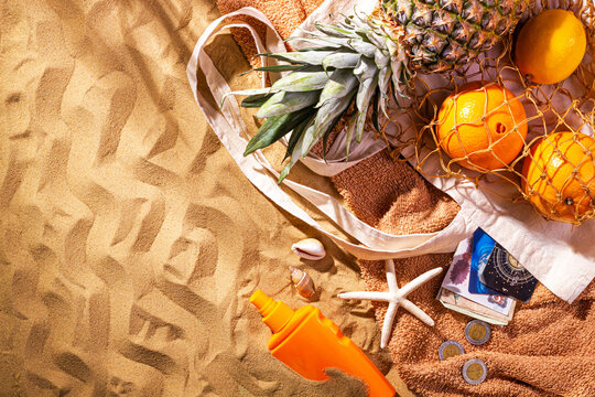 Egypt vacation concept with souvenirs and accessories. Beach sand background with copy space for text, flat lay