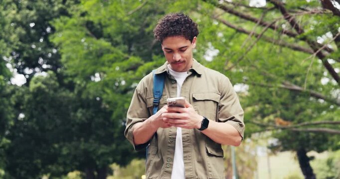 Man, walk and outdoor at college with phone, check social media post and email for higher education. Student, person and journey in park with tech, university portal and online learning platform.