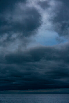 Dark storm clouds in the sky over the Strait of Juan de Fuca in Washington, an offshore storm.