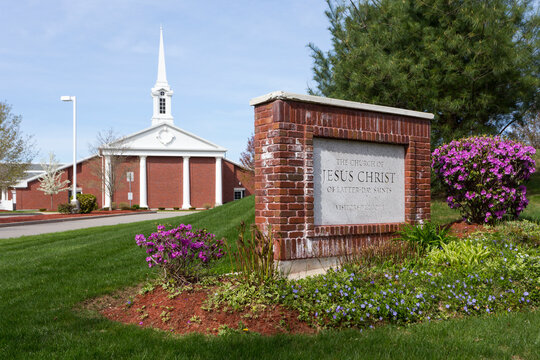 The Church of Jesus Christ Of Latter Day Saints in Franklin, a traditional building with a white spire and portico and columns and a welcome sign.