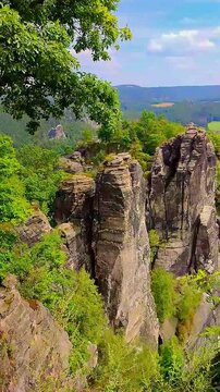Bastei sandstone pillars, stacks at Kurort Rathen village in the national park Saxon Switzerland, Saxony, Germany.