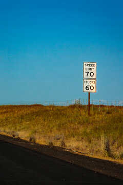Speed sign for 70 mph for cars and 60 mph for trucks on Intersate 90.