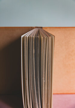 Close up of antique opened book or journal, balanced upright