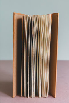 Close up of antique opened book or journal, balanced upright