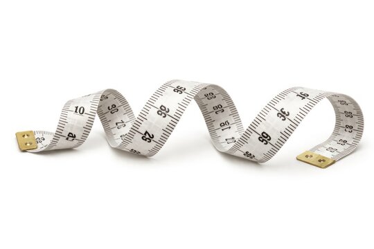 Flexible measuring tape on white background.