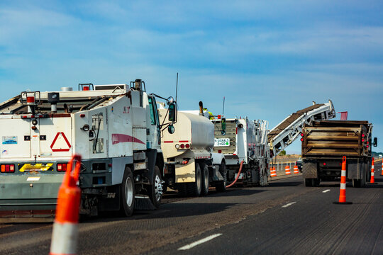 Highway construction along Interstate 90 between Vantage and George, work vehicles, tarmac lorries and road mending equipment.