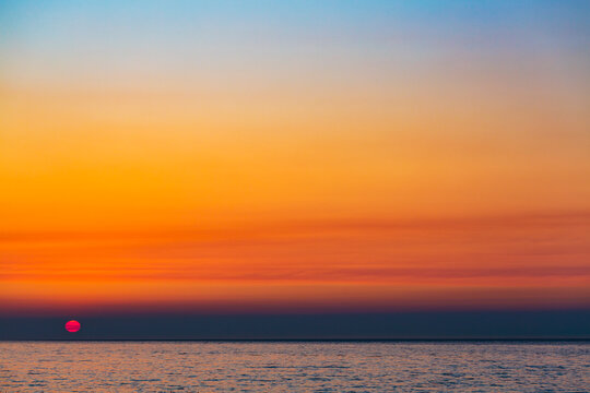 Wildfire smoke in the sky at sunset over the Strait of Juan de Fuca, Port Angeles.