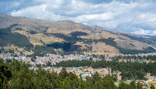 Andean slopes and the urban edge of Huancayo seen from the hills near Cochas in Jun&iacute;n, Peru. Elevated view across the highland landscape showing residential districts, eucalyptus woodland.
