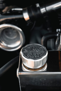 Close-up of a vintage GMC Ral emblem and chrome mechanical components inside a classic vehicle, highlighting automotive heritage and craftsmanship.