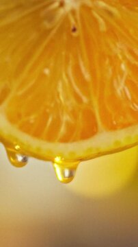 Macro photography of a cut citrus fruit, focusing on agriculture and fresh food. Tiny seeds, complex fibrous segments, and glistening droplets of juice appear on the wet surface