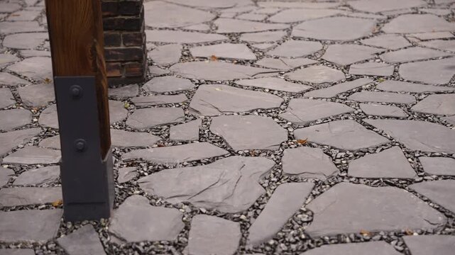 Slow pan across a modern slate flagstone patio with gravel joints
