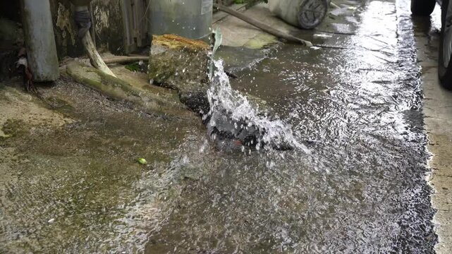Shallow water trickles down a rocky garden channel
