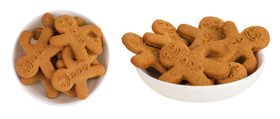 Fototapeta premium Gingerbread man in ceramic bowl isolated on white background. Top view. Flat lay.