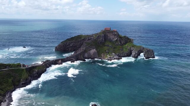 Aerial View of San Juan de Gaztelugatxe Hermitage on Rocky Islet, Basque Country, Spain. Suitable for tourism, coastal promotion, and travel.
