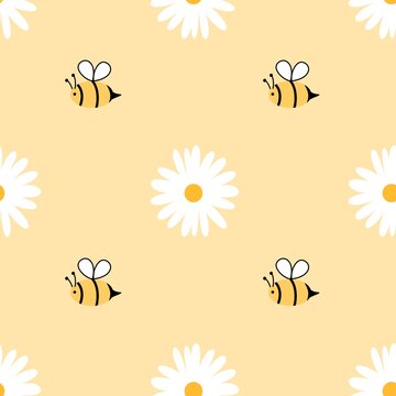Large bees and bold daisies create a playful seamless pattern on a soft yellow background