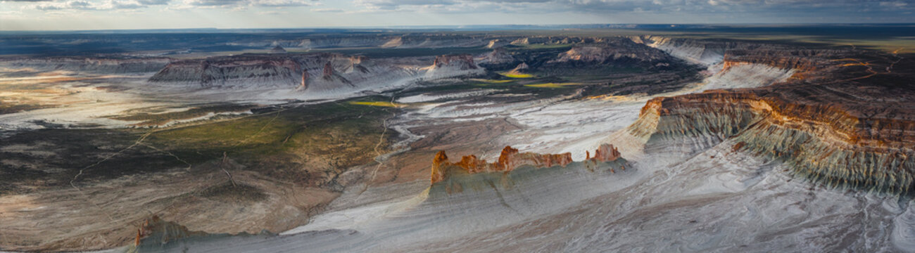 Aerial view of the dramatic limestone rock formations and desert landscape of Bozjyra in the Ustyurt Plateau, Aktau, Mangystau Region, Kazakhstan.