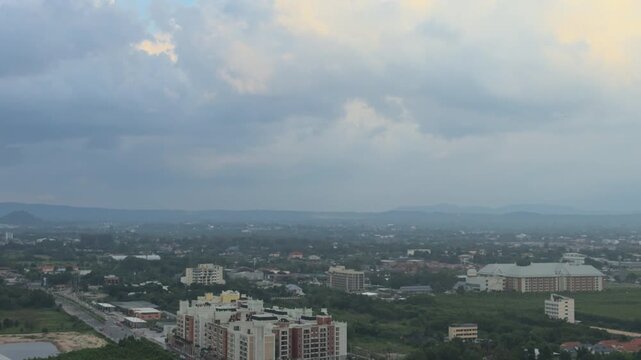 Aerial view of Pattaya beach and sea during cloudy weather before tropical storm, Thailand. Drone shot of coastal cityscape, sandy shoreline and dramatic storm clouds over the ocean, seascape concept.