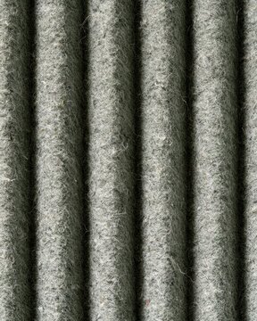 Macro vertical corrugated dirty air filter texture with lint and dust for poster, background and design use