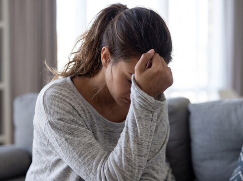 woman suffering from severe headache and migraine