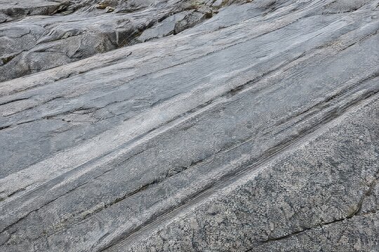 Glacial striations on polished granite bedrock