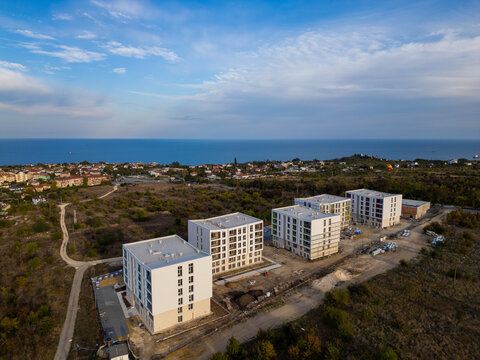 Aerial view of new apartment buildings under construction near the sea coast