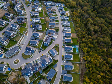 Aerial view of a modern cottage village near the sea and forest