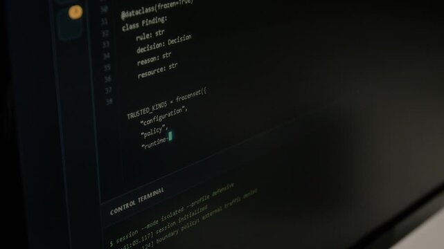 Computer monitor screen displaying cybersecurity programming code and terminal commands being typed, extreme close up. Footage suitable for software development and data security corporate videos
