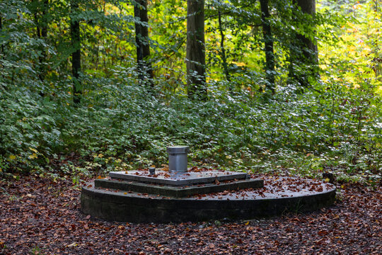 Water well cover in autumn forest, Germany, Bavaria, Augsburg, 5 October 2026