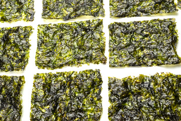 Tasty nori seaweed isolated on white. © Nikolay