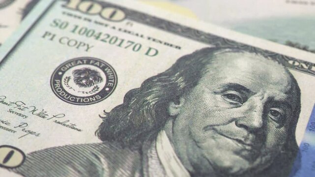 Close up of scattered one hundred american dollar bills