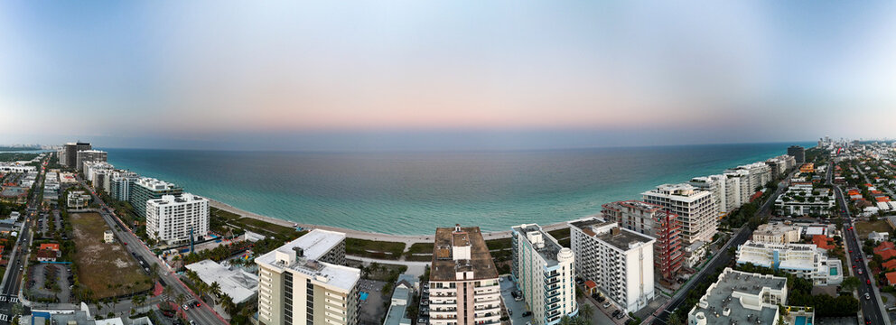 Aerial view of the Four Seasons Hotel at The Surf Club and surrounding coastal buildings along the beach in Surfside, Florida, United States.